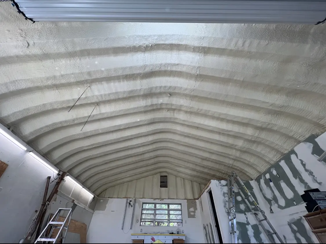 Spray polyurethane foam applied to the underside of a metal roof deck in Orting